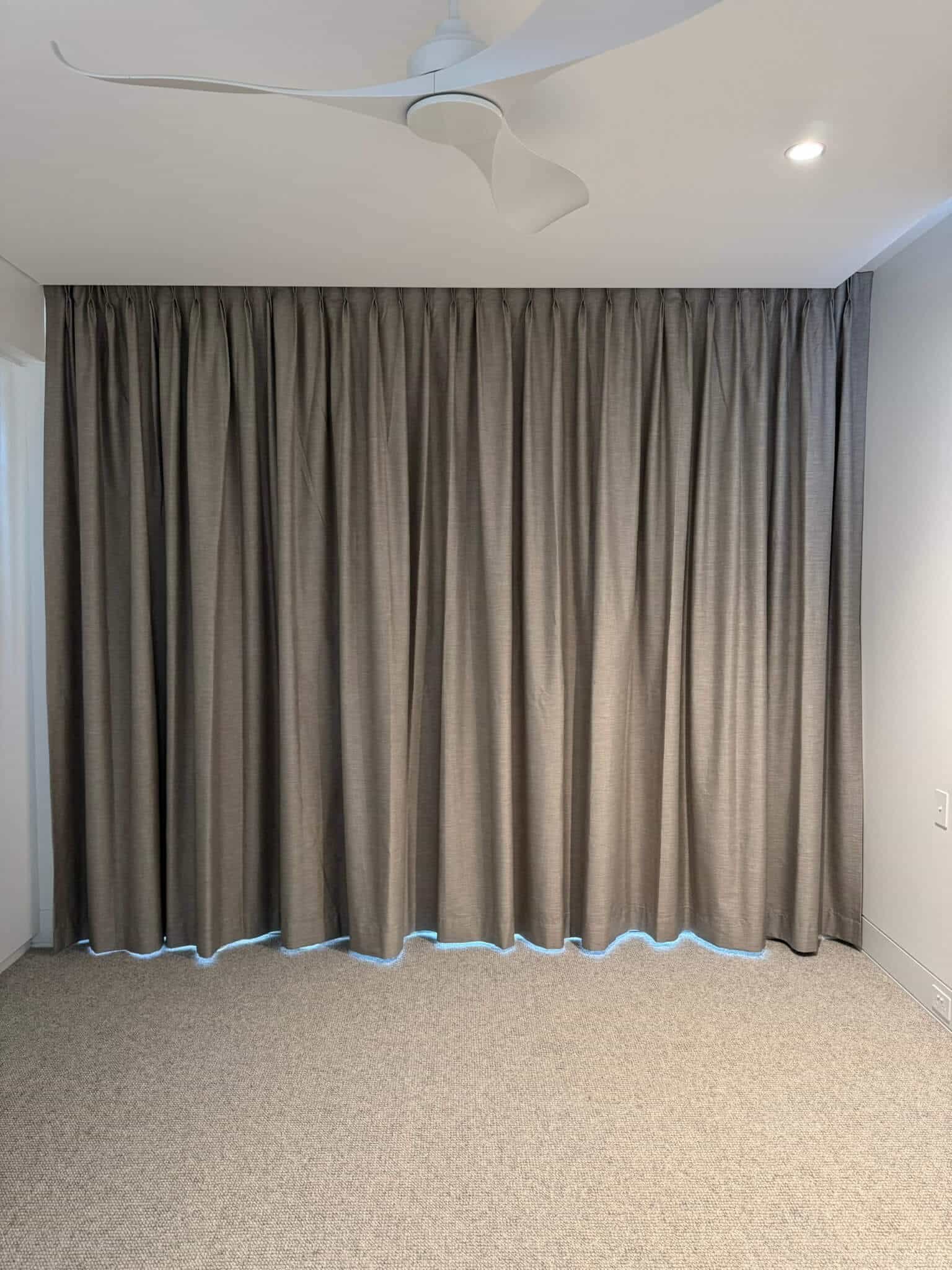 Blockout curtains installed in a modern office to reduce glare and improve focus